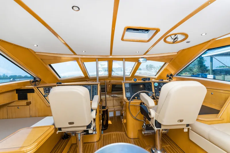 Slide: The Image of Interior of 2000 Jutson 46 LRC yacht with modern helm and seating. - 30