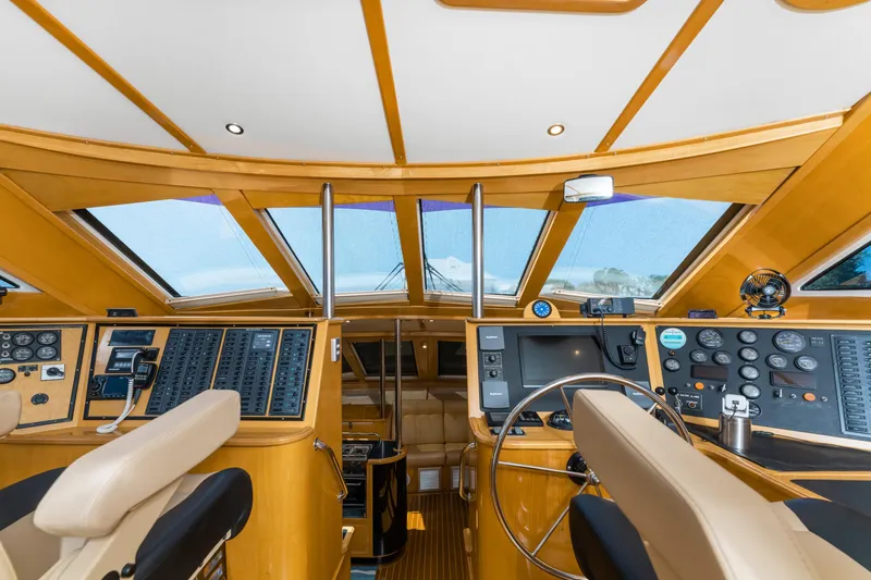 Slide: The Image of Interior view of 2000 Jutson 46 LRC yacht cockpit with navigation controls. - 31