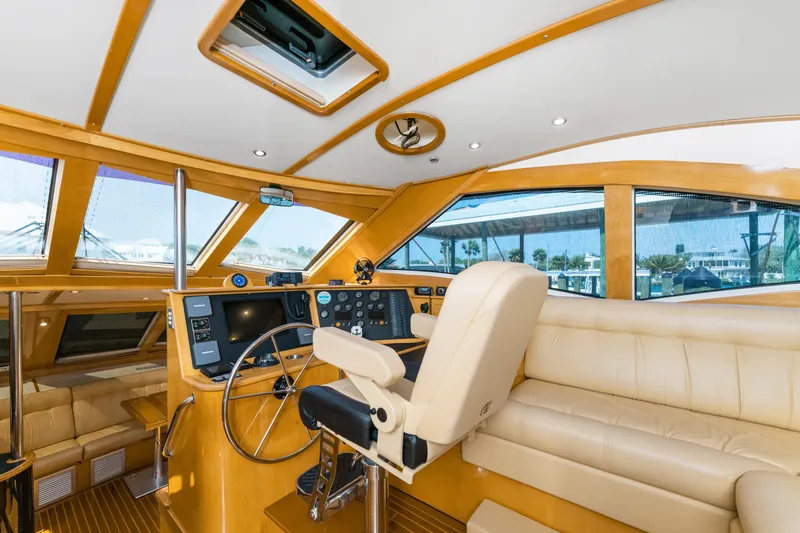 Slide: The Image of Luxurious interior of 2000 Jutson 46 LRC yacht with helm and seating area. - 32