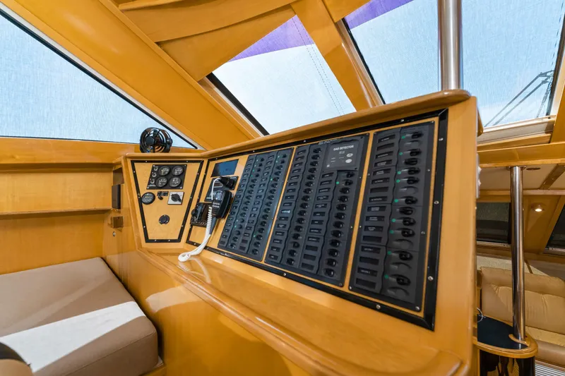 Slide: The Image of Control panel of 2000 Jutson 46 LRC yacht with wooden interior and navigation instruments. - 37