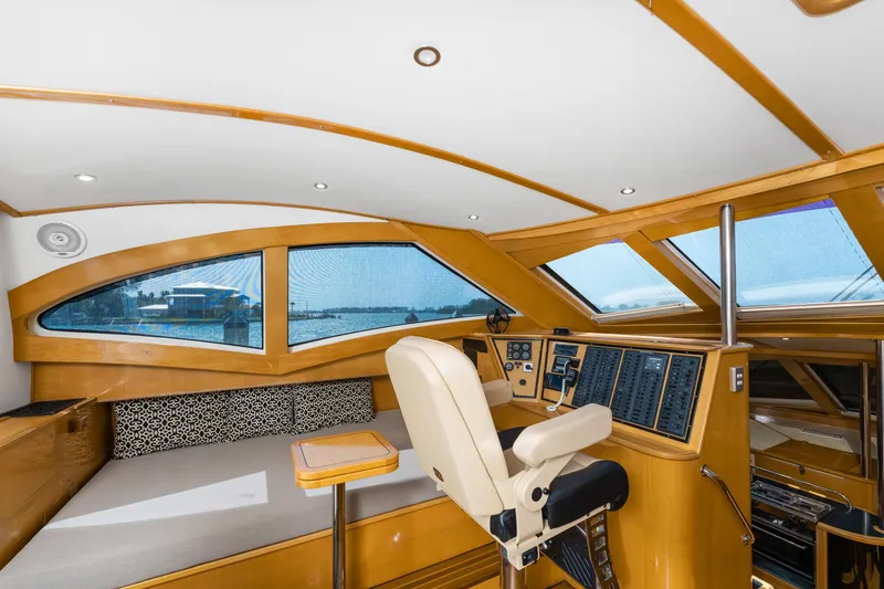 Slide: The Image of Luxurious interior of 2000 Jutson 46 LRC yacht with modern helm and panoramic windows. - 38
