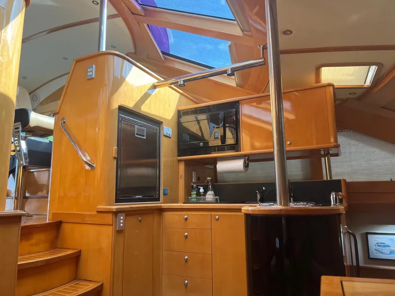 Slide: The Image of Interior of 2000 Jutson 46 LRC yacht with modern kitchen. - 46