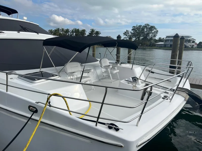 Slide: The Image of Jutson 46 LRC 2000 yacht docked with sunshade. - 5