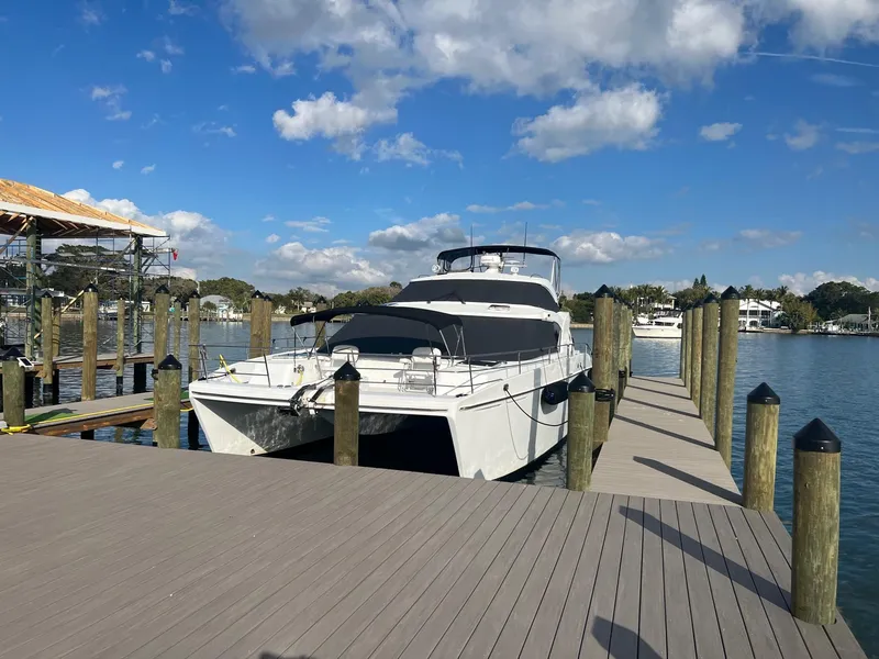 Slide: The Image of 2000 Jutson 46 LRC yacht docked on a sunny day. - 6