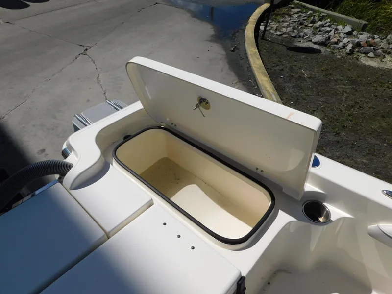 Slide: The Image of Open storage compartment on 2022 ShearWater 250 XTE boat. - 10