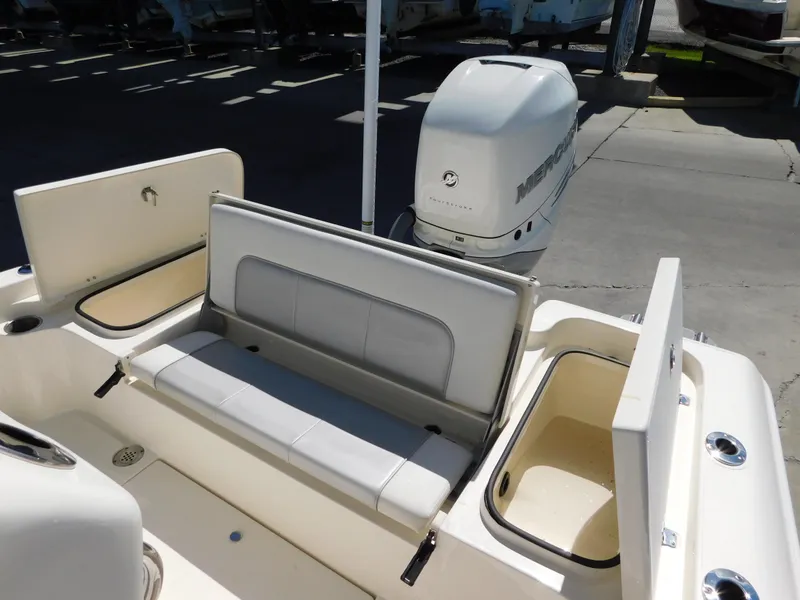 Slide: The Image of 2022 ShearWater 250 XTE boat interior with seating and storage compartments. - 12