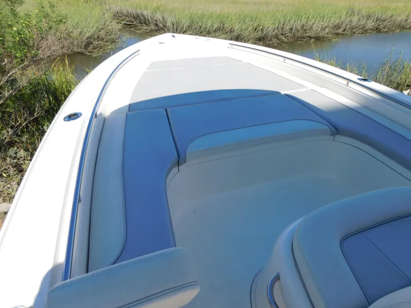 Slide: The Image of 2022 ShearWater 250 XTE boat with spacious seating and sleek design. - 17