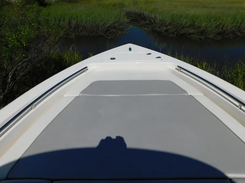 Slide: The Image of 2022 ShearWater 250 XTE boat bow in a serene marsh setting. - 18