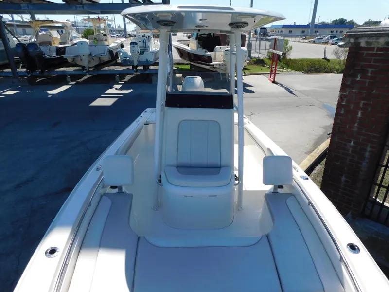 Slide: The Image of 2022 ShearWater 250 XTE boat, white interior, docked at marina. - 20