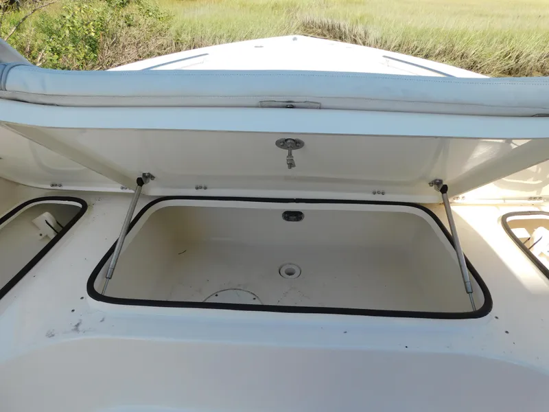 Slide: The Image of Open storage compartment on 2022 ShearWater 250 XTE boat. - 24
