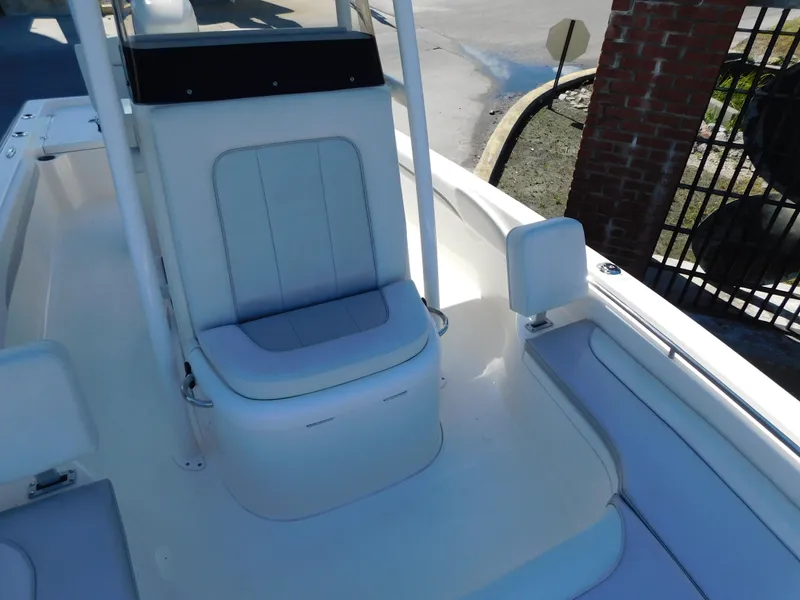 Slide: The Image of 2022 ShearWater 250 XTE boat interior with white seating and sleek design. - 26