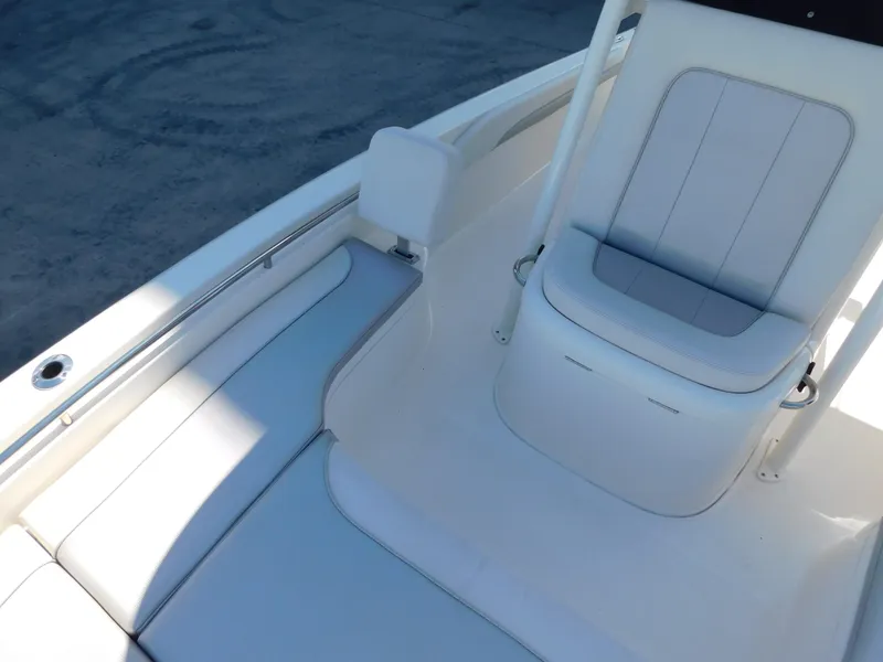 Slide: The Image of 2022 ShearWater 250 XTE boat interior with white seating and sleek design. - 27