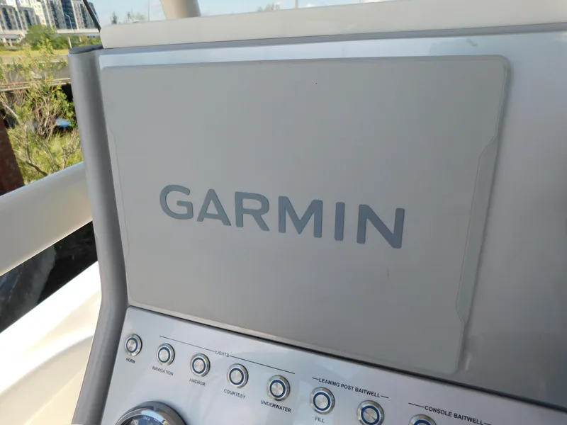 Slide: The Image of Garmin navigation system on 2022 ShearWater 250 XTE boat dashboard. - 31