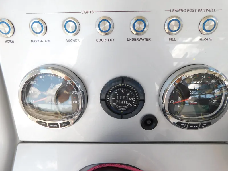 Slide: The Image of Dashboard of 2022 ShearWater 250 XTE boat with gauges and control buttons. - 34