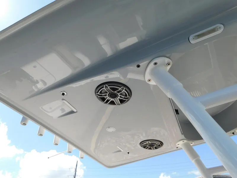 Slide: The Image of 2022 ShearWater 250 XTE boat canopy with built-in speakers and rod holders. - 37