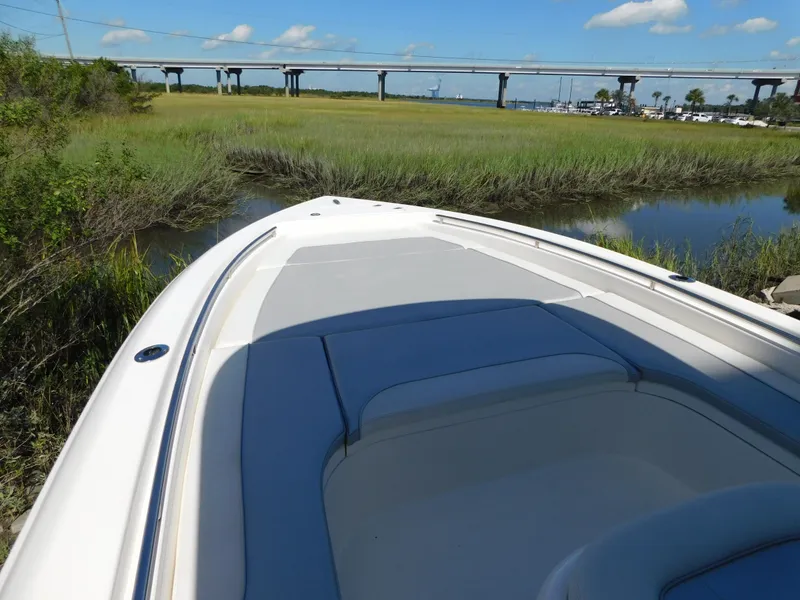 Slide: The Image of 2022 ShearWater 250 XTE boat in marshland with bridge in background. - 41