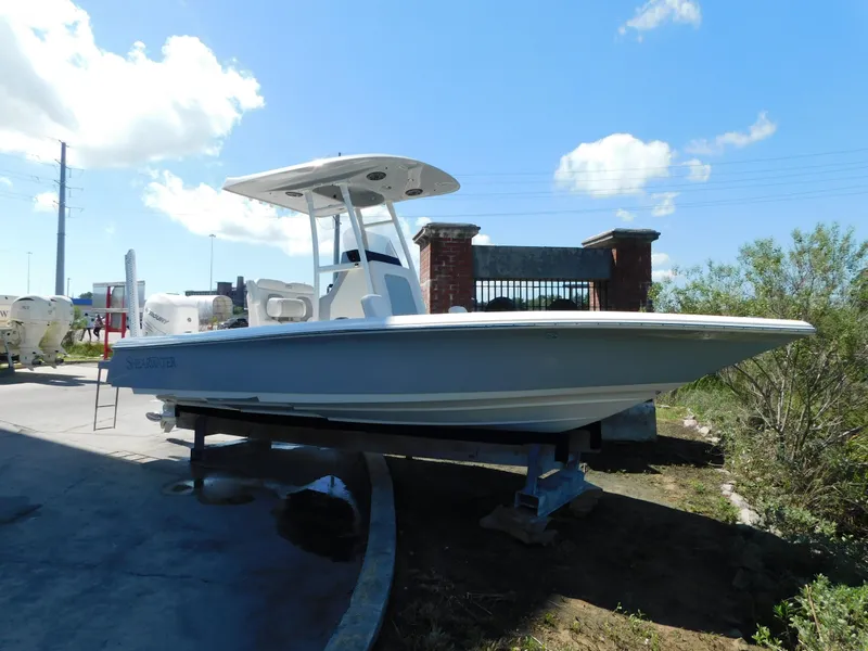 Slide: The Image of 2022 ShearWater 250 XTE boat on display under a clear blue sky. - 44