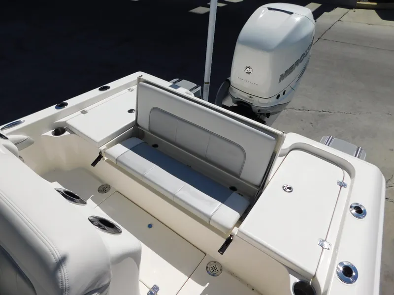 Slide: The Image of 2022 ShearWater 250 XTE boat interior with seating and motor. - 45