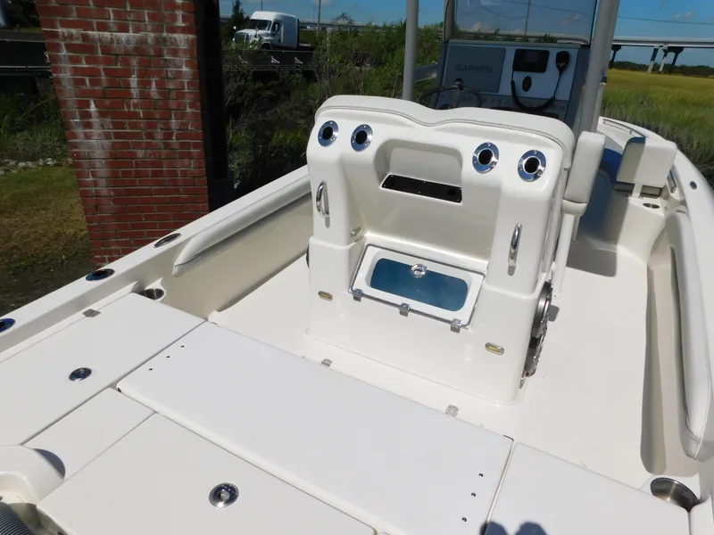 Slide: The Image of 2022 ShearWater 250 XTE boat interior with console and seating area. - 46