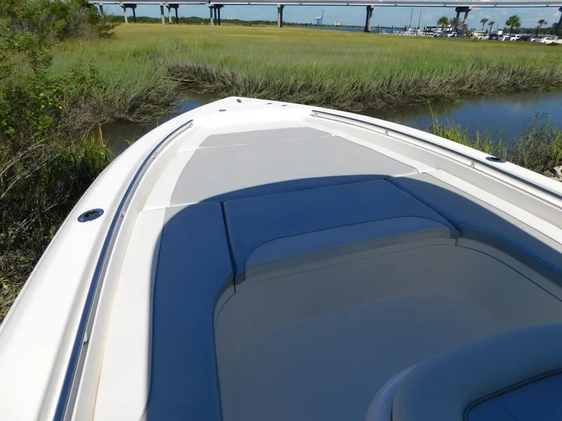 Slide: The Image of 2022 ShearWater 250 XTE boat deck with scenic marshland and bridge view. - 47