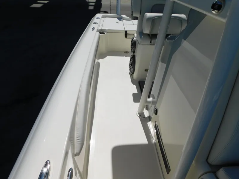 Slide: The Image of 2022 ShearWater 250 XTE boat interior with white seating and sleek design. - 48