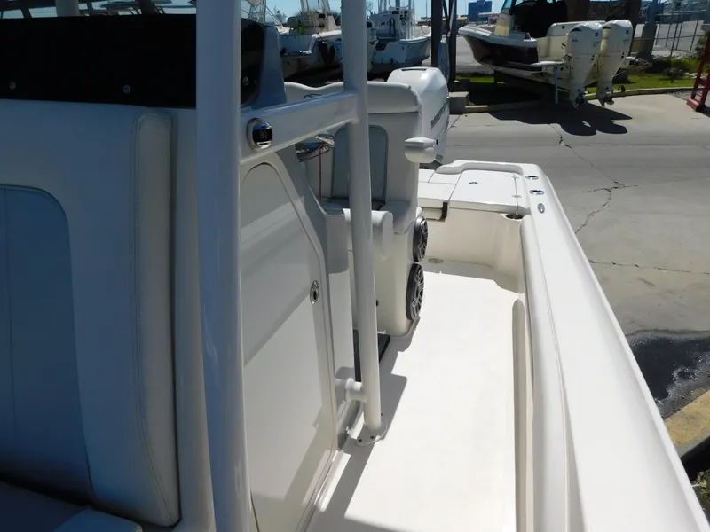 Slide: The Image of 2022 ShearWater 250 XTE boat interior, featuring sleek white design and spacious deck area. - 49