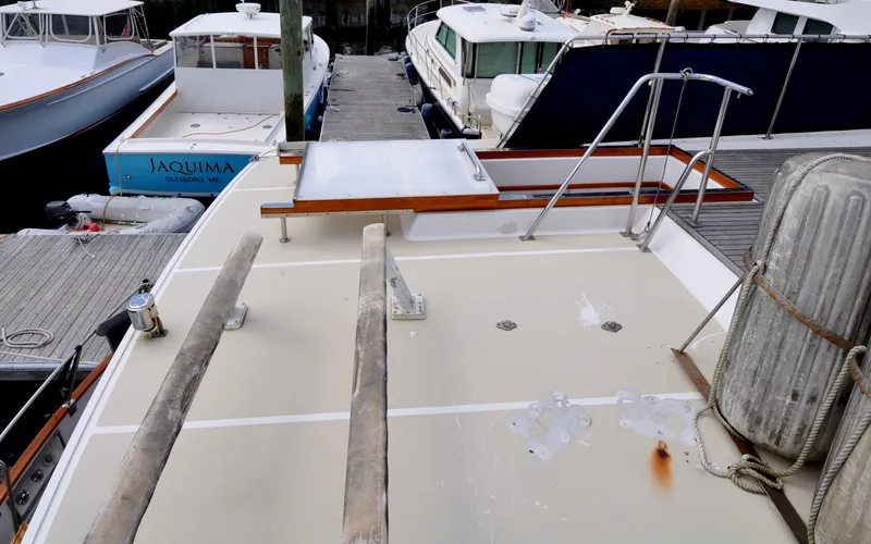 Slide: The Image of Deck of 2000 Grand Banks Heritage Europa 52 yacht docked at marina. - 17