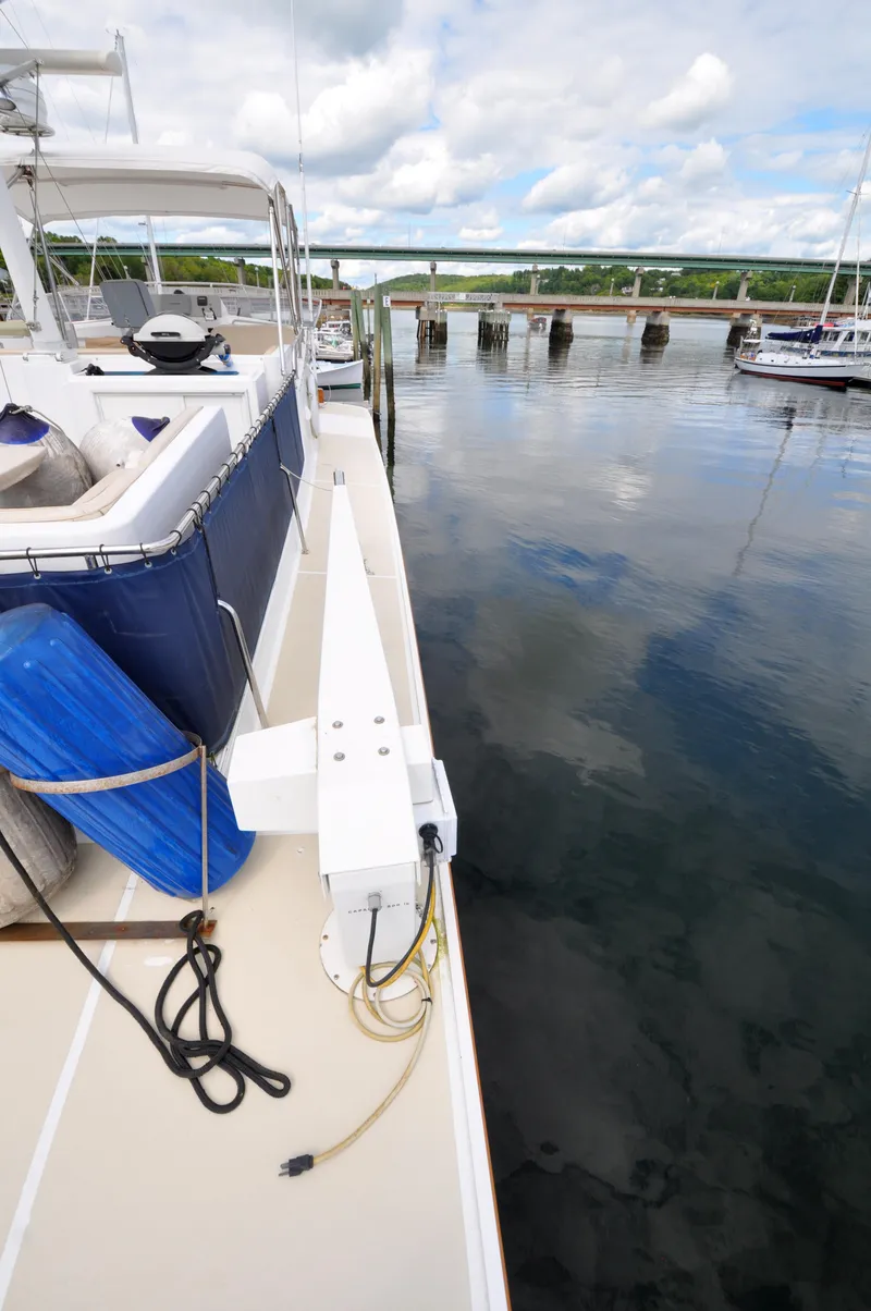 Slide: The Image of Grand Banks Heritage Europa 52 yacht docked by calm waters, 2000 model. - 18