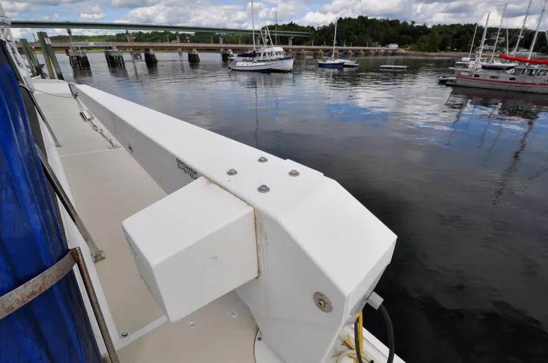 Slide: The Image of Grand Banks Heritage Europa 52 yacht docked near a calm marina, 2000 model. - 19