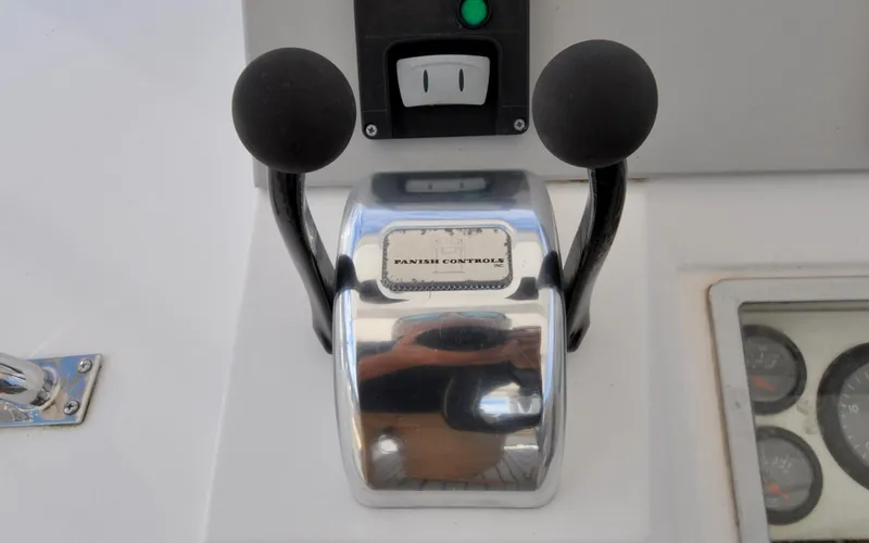 Slide: The Image of Throttle controls on a 2000 Grand Banks Heritage Europa 52 yacht dashboard. - 33