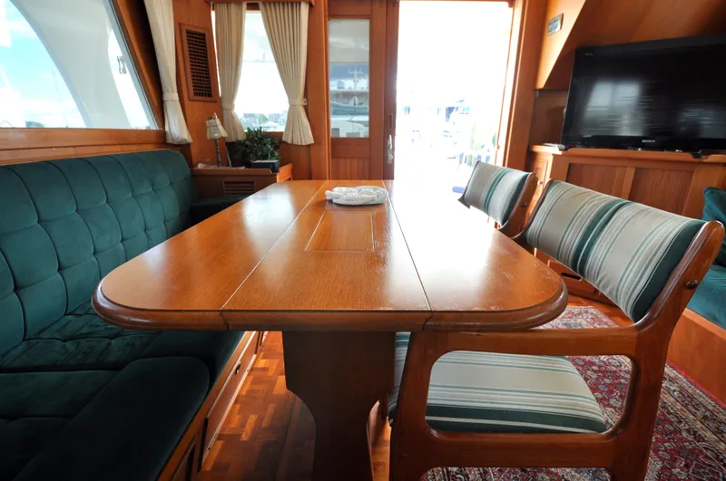 Slide: The Image of Interior of 2000 Grand Banks Heritage Europa 52 yacht with elegant dining area. - 45
