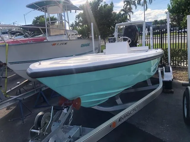 Slide: The Image of 2025 Piranha Alvo F1700 boat on trailer, parked outdoors, sunny day. - 1