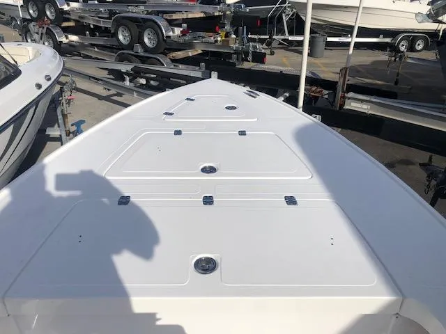 Slide: The Image of Bow of 2025 Piranha Alvo F1700 boat in a marina setting. - 13