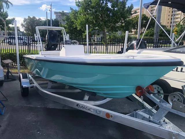 Slide: The Image of 2025 Piranha Alvo F1700 boat on trailer, turquoise hull, outdoor setting. - 3