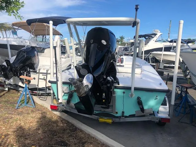 Slide: The Image of 2025 Piranha Alvo F1700 boat with outboard motor in marina setting. - 4