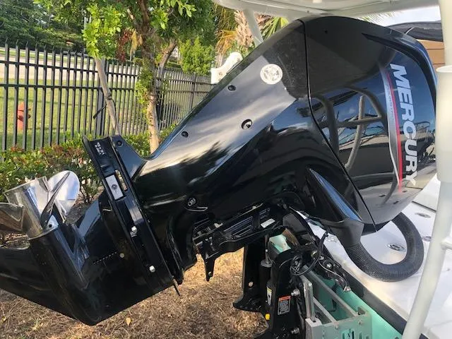 Slide: The Image of Outboard motor on a boat, Piranha Alvo F1700, 2025 model, parked near a fence. - 5