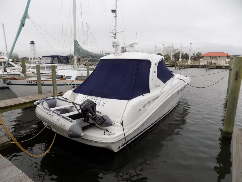 Slide: The Image of 2006 Sea Ray 44 Sundancer docked at marina with blue cover. - 10
