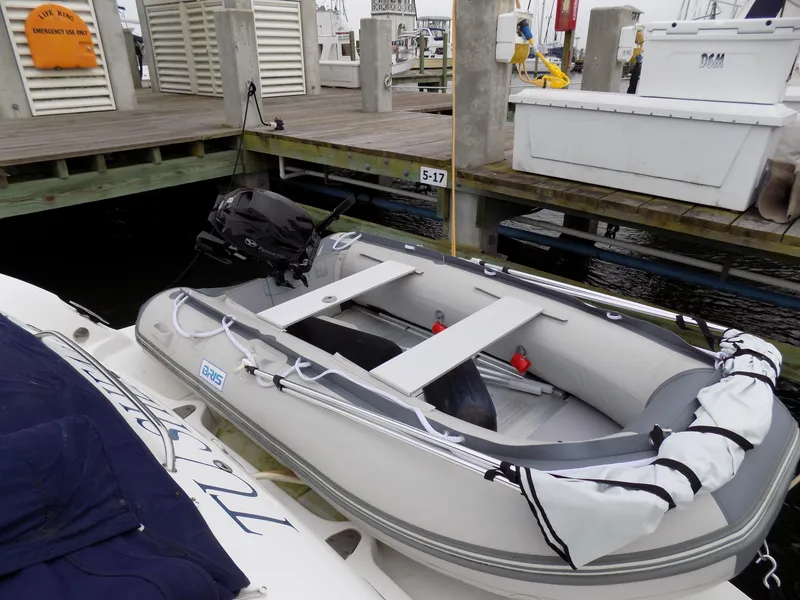 Slide: The Image of Inflatable dinghy docked beside a 2006 Sea Ray 44 Sundancer yacht. - 12