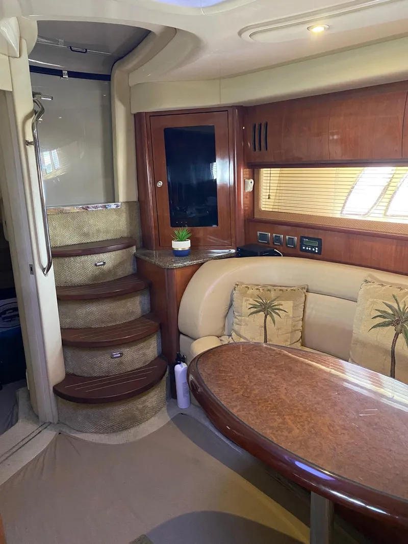 Slide: The Image of Interior of 2006 Sea Ray 44 Sundancer yacht with elegant seating and wooden finishes. - 18