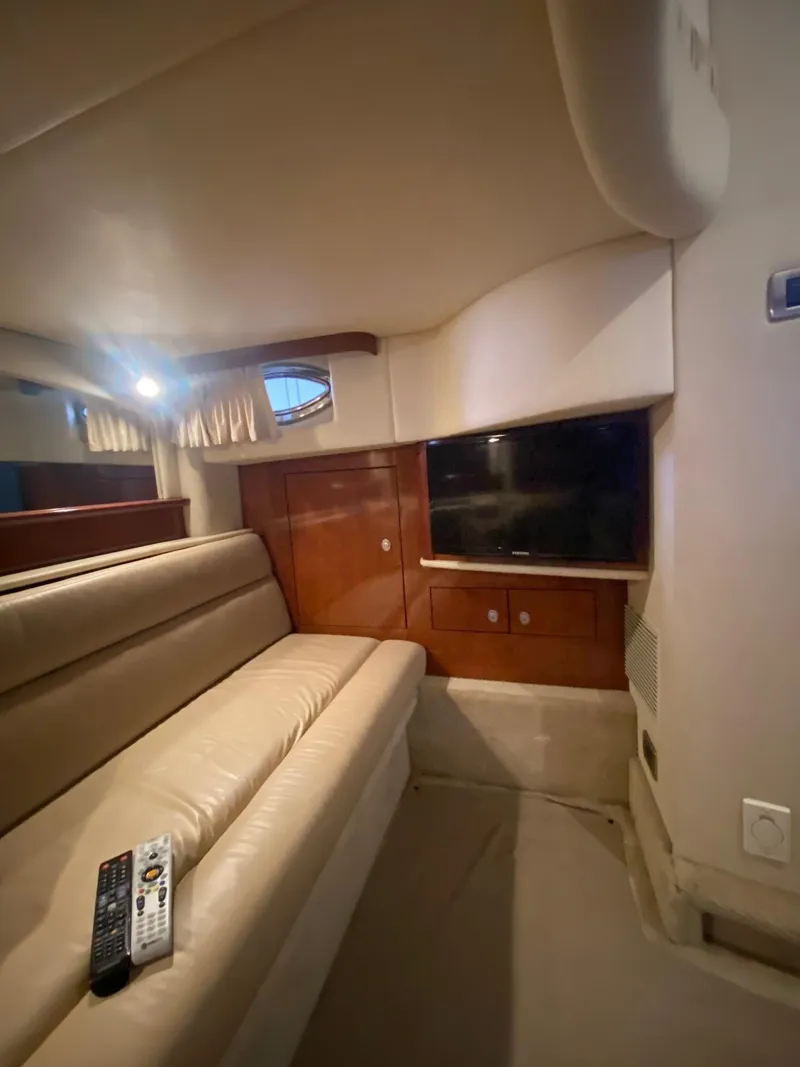 Slide: The Image of Interior of 2006 Sea Ray 44 Sundancer yacht with leather seating and TV. - 21