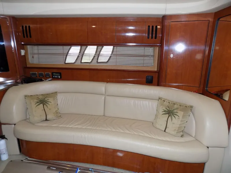 Slide: The Image of 2006 Sea Ray 44 Sundancer interior with leather sofa and palm tree pillows - 34