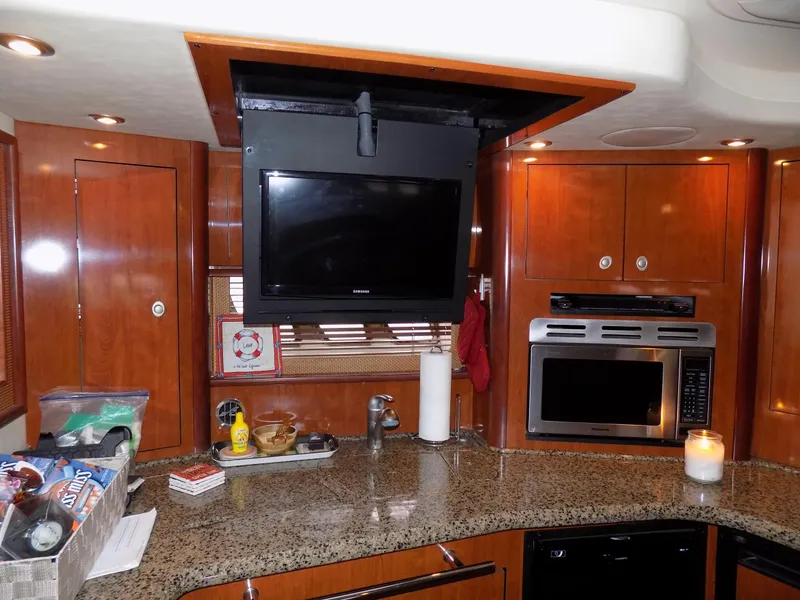 Slide: The Image of Interior kitchen of 2006 Sea Ray 44 Sundancer yacht with TV and modern appliances. - 38