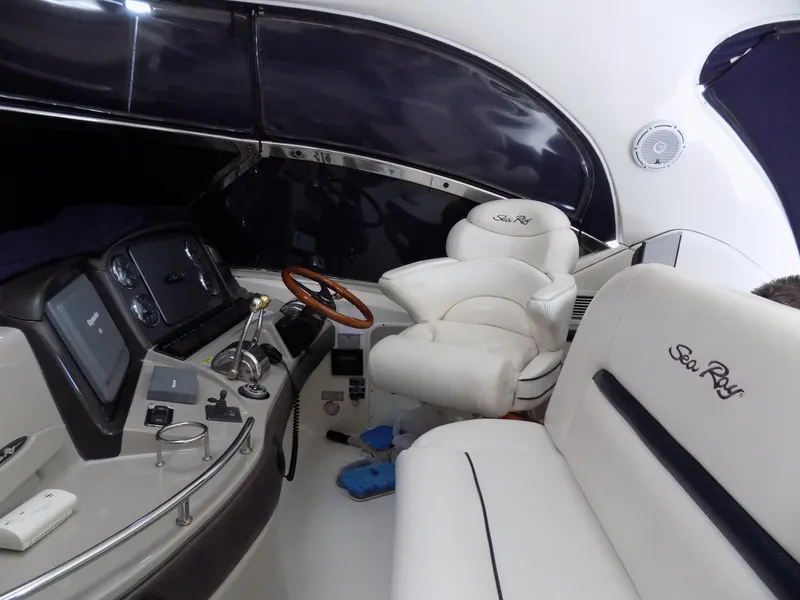 Slide: The Image of Interior of 2006 Sea Ray 44 Sundancer yacht with white leather seating and control panel. - 41