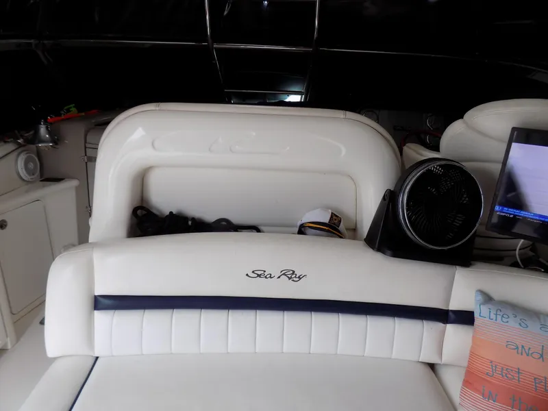 Slide: The Image of Interior of a 2006 Sea Ray 44 Sundancer yacht with white leather seating. - 42