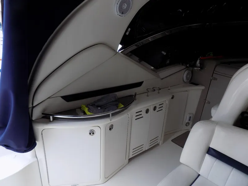 Slide: The Image of Interior of 2006 Sea Ray 44 Sundancer yacht with storage cabinets and seating. - 46
