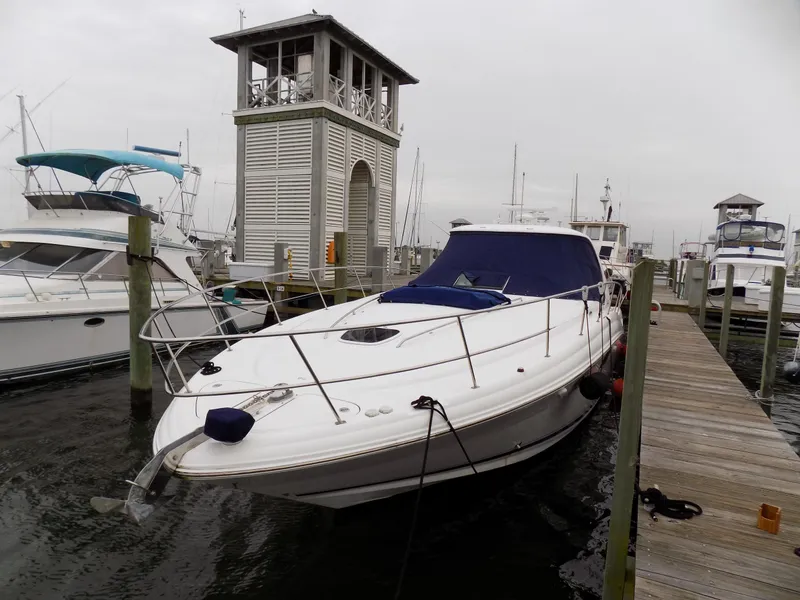 Slide: The Image of 2006 Sea Ray 44 Sundancer yacht docked at marina with other boats. - 6