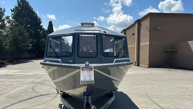 Slide: The Image of 2025 Spartan 215 Athens boat on trailer in parking lot, sunny day. - 3