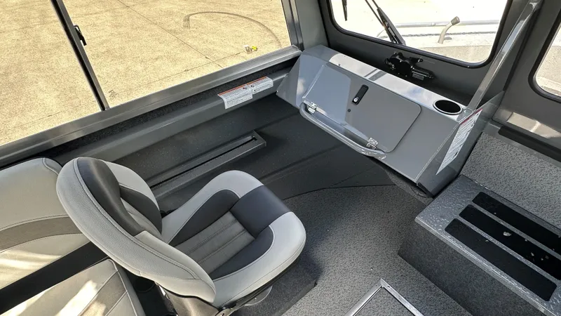 Slide: The Image of Interior of 2025 Spartan 215 Athens boat with seating and control panel. - 6