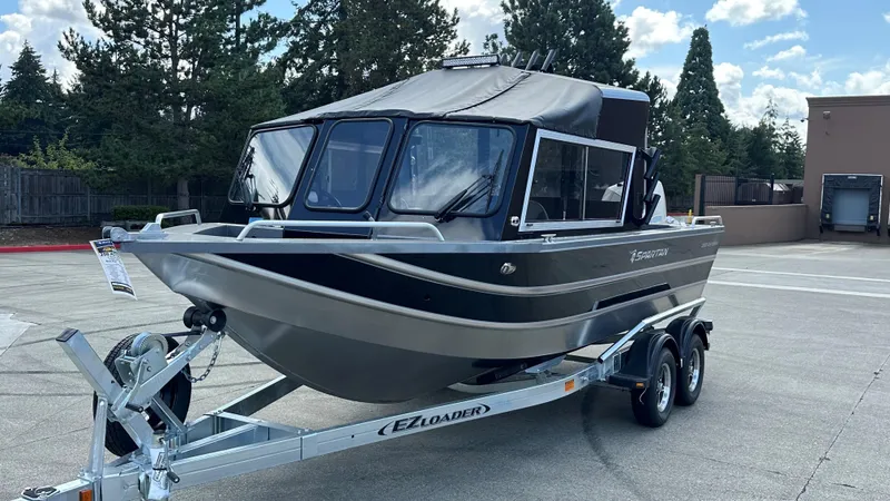 The Image of 2024 Spartan 200 Astoria boat on trailer, parked outdoors. - 0