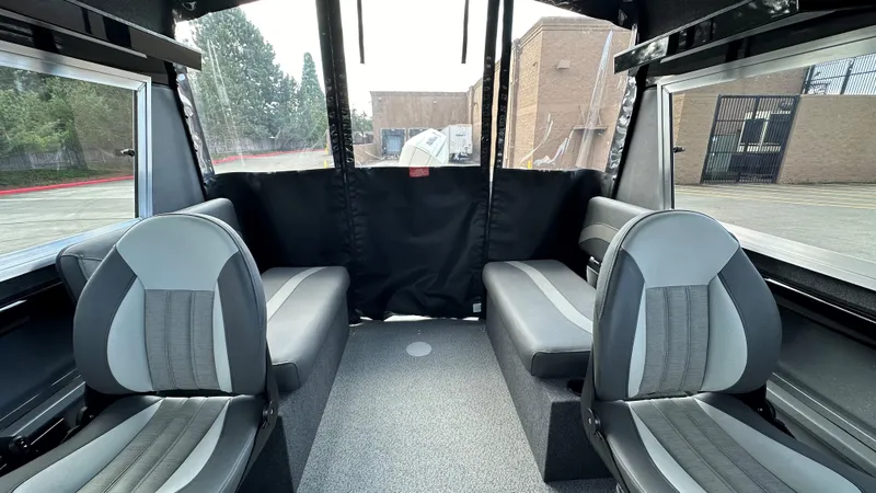 Slide: The Image of 2024 Spartan 200 Astoria interior with gray seating and large windows. - 4